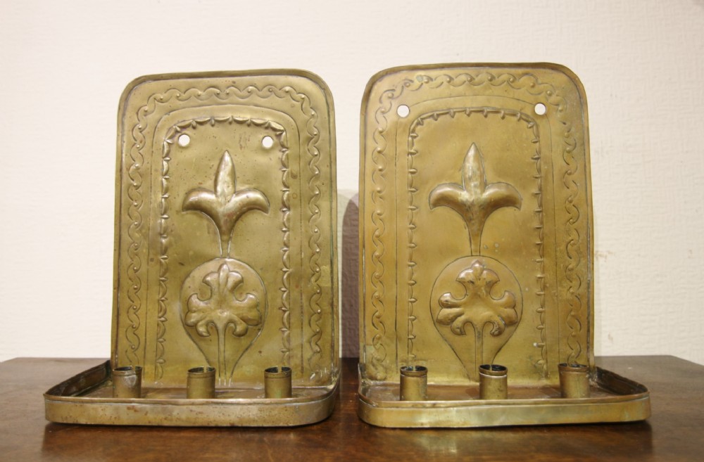 a pair of early dutch brass candle wall sconces