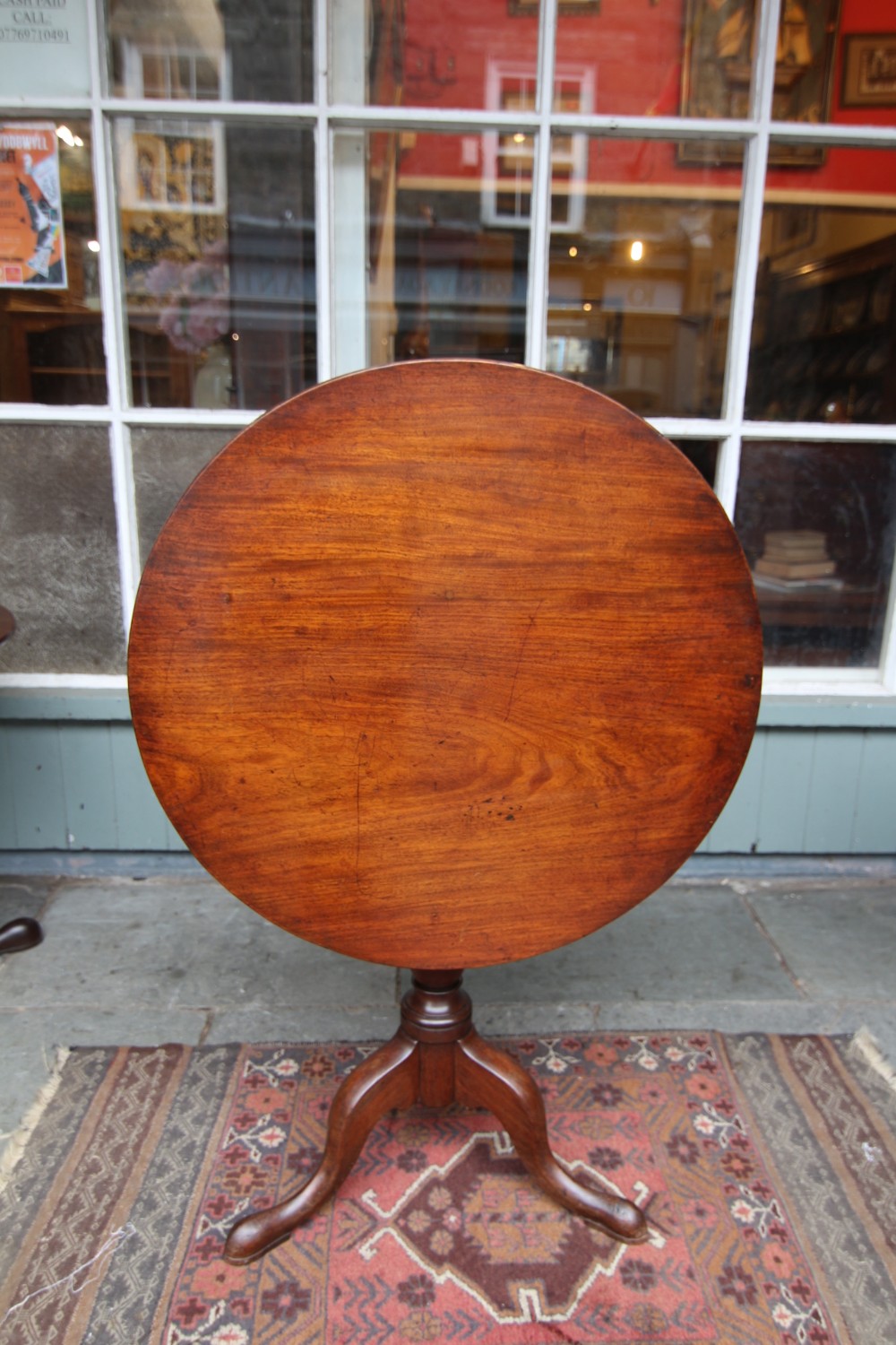 18th century golden mahogany tilt top tripod table