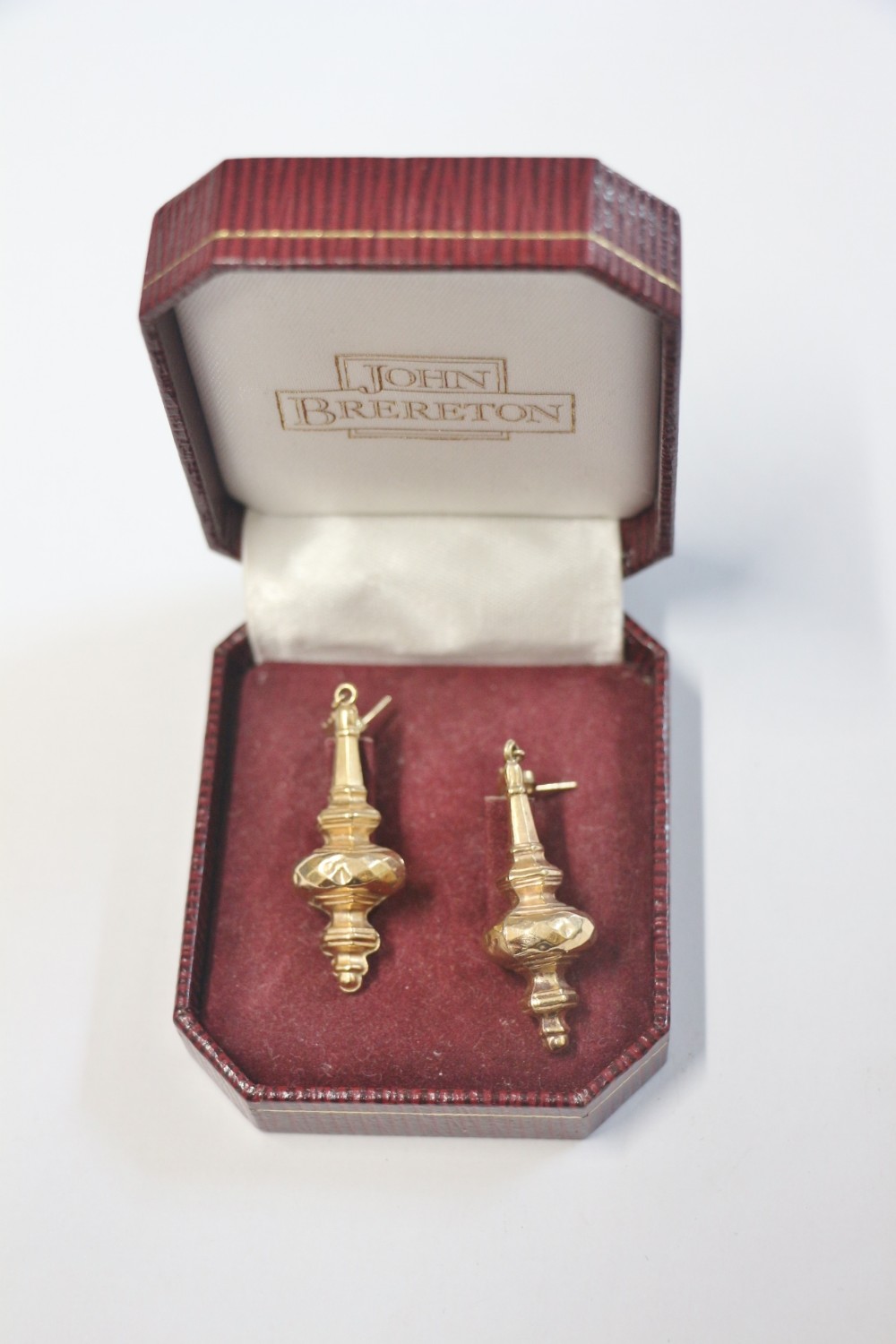 a pair of large 9ct gold drop earings