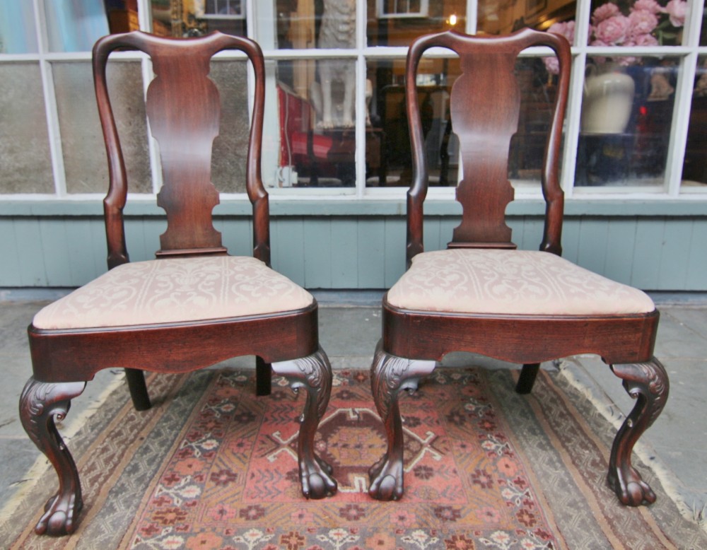 fine pair of early georgian red walnut high back chairs