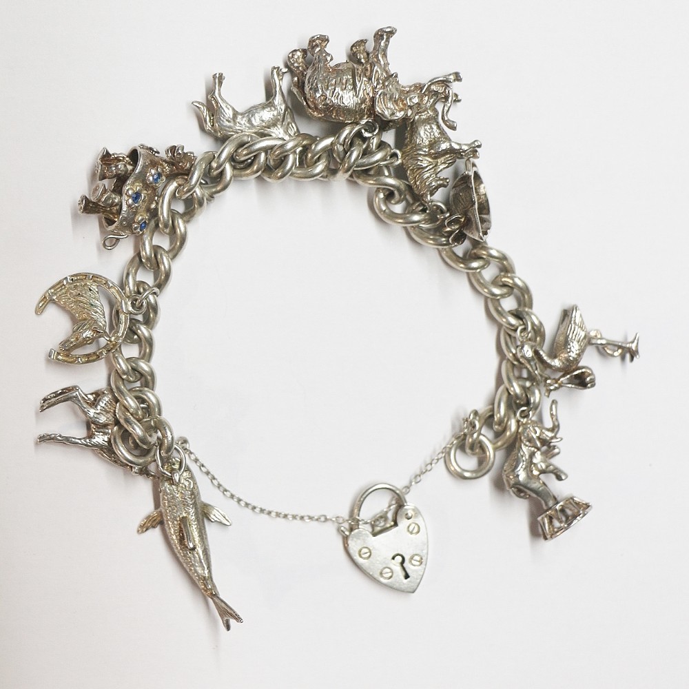 large silver charm bracelet with animals