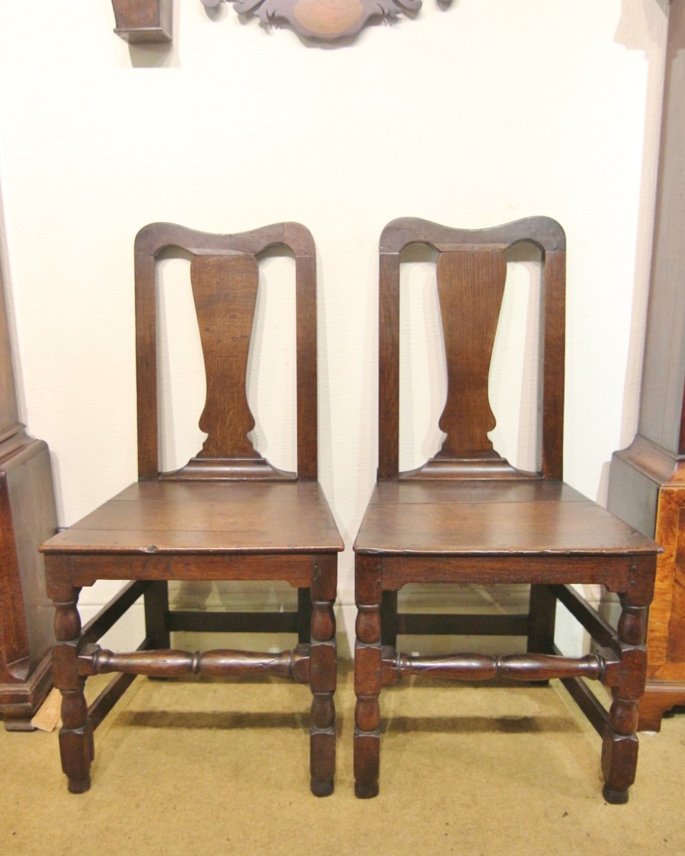 pair of stamped early 18th century oak high back chairs